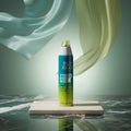 Tigi Bed Head Master Piece hair styling spray can in a teal, white, and lime green color scheme.