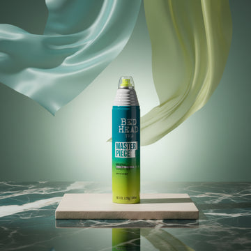Tigi Bed Head Master Piece hair styling spray can in a teal, white, and lime green color scheme.