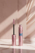 Pink mascara with brush and 'Sensational' text on a white background