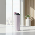 Purple water bottle with a purple and pink cap on a white background