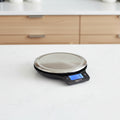 Digital kitchen scale with dimensions labeled on a white background