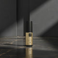 ghd hair product bottle on a white background