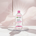 Garnier Micellar Cleansing Water All-in-1 in a 700ml clear bottle with a bright pink cap and pink label accents.