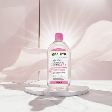 Garnier Micellar Cleansing Water All-in-1 in a 700ml clear bottle with a bright pink cap and pink label accents.