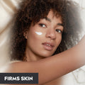 Woman with a skincare product on her face, with text 'Firms Skin' below.