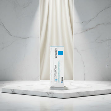 La Roche-Posay Cicapiast Baume B5+ cosmetic packaging card, featuring a white background with blue and black text, a blue square logo block, and the Microbiome Science brand logo.