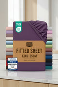 Stack of Utopia Bedding fitted sheets with a purple sheet on top and a brown label.