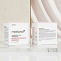 Two boxes of Medicube Red Succinic Acid Peeling Pad on a white background
