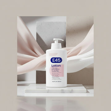 A white bottle of E45 Lotion with a pump dispenser, featuring a blue and pink label on a clean white background.