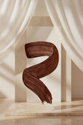 Wavy brown hair color swatch on a white background
