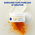 Nivea Q10 anti-wrinkle cream jar with orange powder and text 'Enriched with Pure Q10 & Creatine' on a light background
