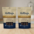 Two 70g bags of Hollings Dog Treats Beef & Wild Boar Bite-Size Sausages, displayed side-by-side against a plain white background.