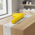 Yellow plastic tool with dimensions labeled on a white background