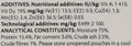 A close-up of a printed ingredient and additives list on a light gray background, showing nutritional additives, technological additives, and analytical constituents with percentages and numbers.