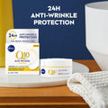 Nivea Q10 anti-wrinkle cream packaging on a wooden surface with a blue background.