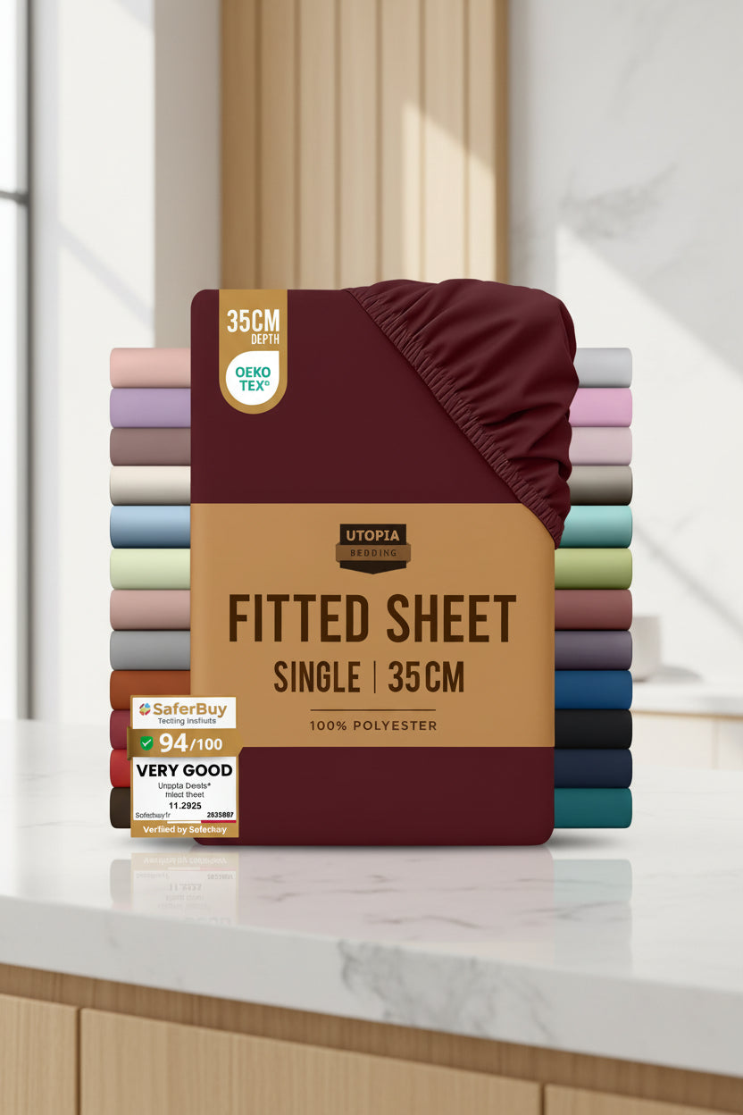 Stack of Utopia Bedding fitted sheets with a maroon sheet on top and color swatches below.