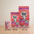 Three bags of Barking Heads Hair Necessities dry dog food in wet 300g, dry 2kg, and dry 12kg sizes, displayed against a pink background with promotional text.