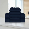 Stack of navy blue folded towels on a white background