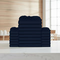 Stack of navy blue folded towels on a white background