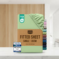 Stack of Utopia Bedding fitted sheets with a green sheet on top, surrounded by other sheets in various colors.