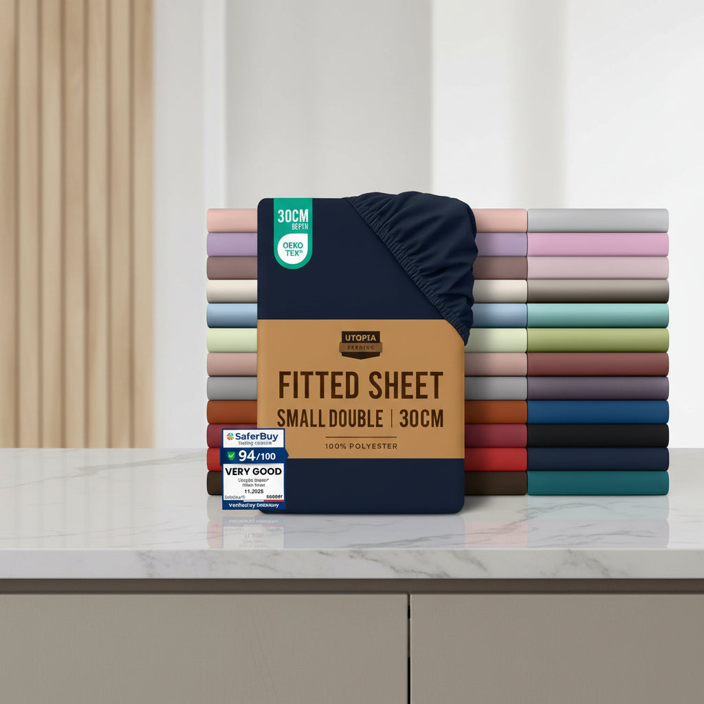 Stack of Utopia Bedding fitted sheets with a brown label and color swatches on a white background.
