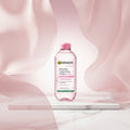 Garnier Micellar Cleansing Water bottle in a large pink glass vessel, with promotional text reading '1 SOLD EVERY 15 SECONDS' and 'THE UK'S NO 1 MICELLAR WATER'.