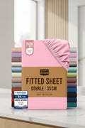 Stack of Utopia Bedding fitted sheets with a pink sheet on top, displayed against a white background.