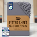 Stack of Utopia Bedding fitted sheets with a brown label and color swatches on a white background.