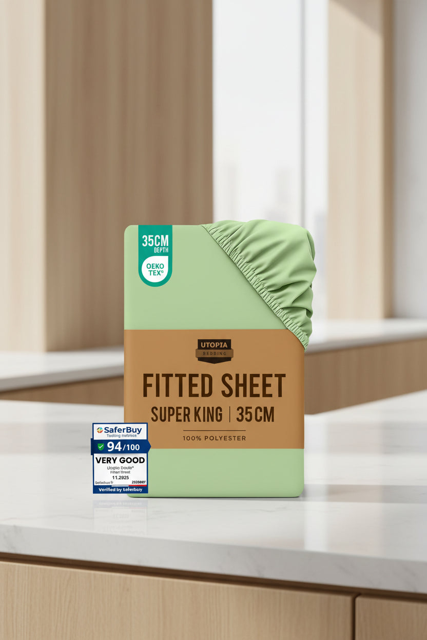 Stack of Utopia Bedding fitted sheets with a green sheet on top, surrounded by other sheets in various colors.