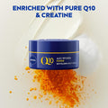 Nivea Q10 anti-wrinkle night cream jar with orange powder on a light background
