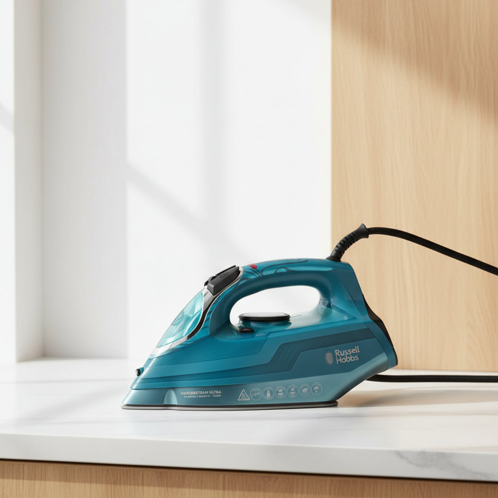A teal blue Russell Hobbs PowerSteam Ultra iron with a black cord, photographed on a clean white background.