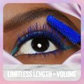 Eyelash curler with blue bristle head applied to an eye, labeled 'Limitless Length + Volume'.