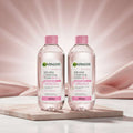 Two 400ml bottles of Garnier Micellar Cleansing Water All-in-1 Sensitive Skin with pink caps, shown side-by-side on a white background.