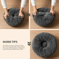 Gray pet bed shown in three stages of being unpacked and expanded on a white background.