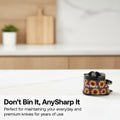 A person in a kitchen uses a large chef's knife to slice a red onion on a wooden cutting board, with the AnySharp knife sharpening and oiling kit shown in the foreground. Text at the bottom reads 'Don't Bin It, AnySharp It'.