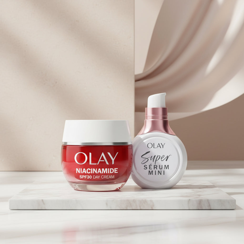 Olay skincare set featuring a jar of Niacinamide SPF30 Day Cream in red and white, and a bottle of Super Sérum Mini in white and rose gold, on a solid white background.