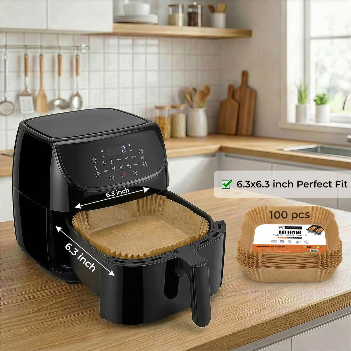 Black air fryer on a kitchen counter with bread baskets and measurements displayed.