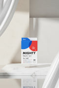 Mighty Patch packaging with blue, red, and white design on a gray background