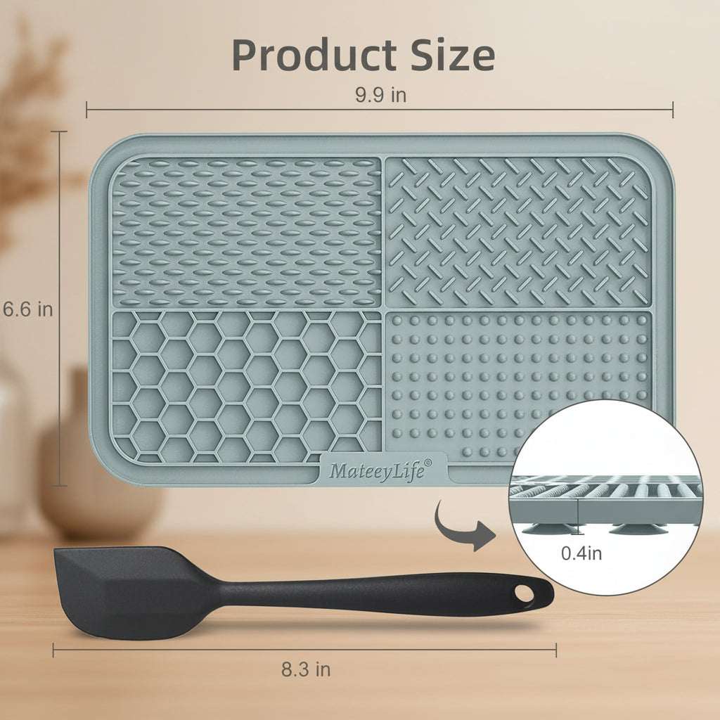 Gray silicone mat with textured surface and measurements, shown with a spatula for scale.