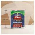 A pack of Bakers Small Dog Meaty Meals dog food shown centered on a gray silhouette of a human torso, with black measurement lines and the text '244 mm' indicating the package height.