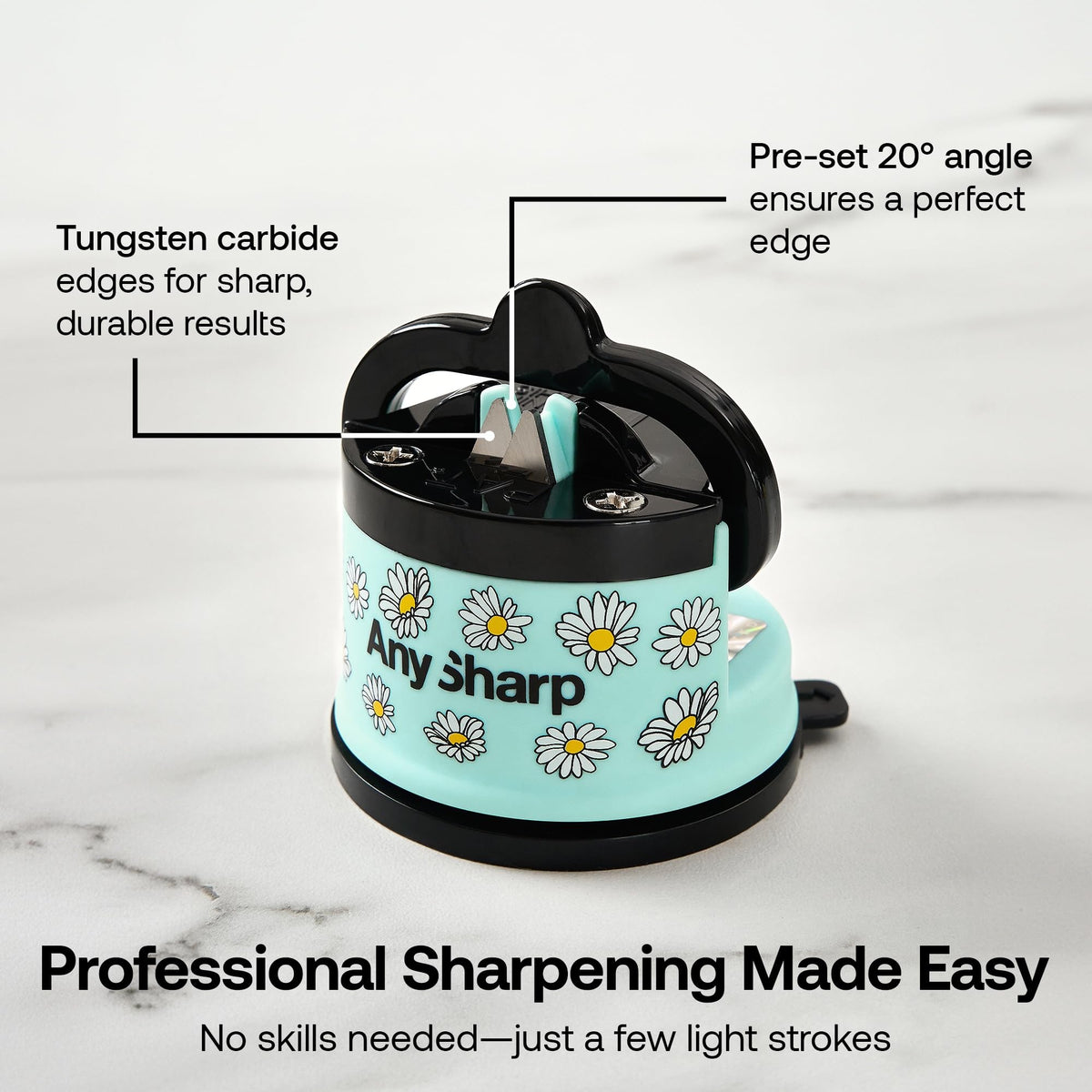 A light blue and black Any Sharp portable kitchen sharpener with a daisy pattern, shown on a white marble background with text callouts explaining its tungsten carbide edges and pre-set angle.