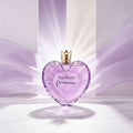 Heart-shaped purple Vera Wang Princess perfume bottle with gold cap on a white background