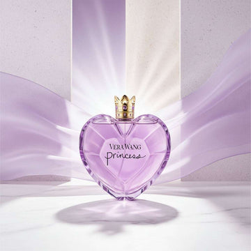 Heart-shaped purple Vera Wang Princess perfume bottle with gold cap on a white background