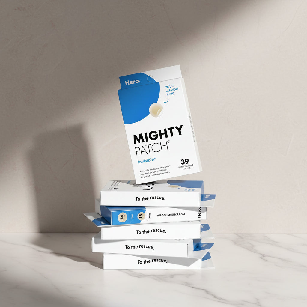 Mighty Patch packaging with hydrocolloid information on a blue tiled wall background