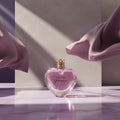 Vera Wang Princess perfume bottle on a purple background