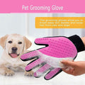 Pet grooming glove with a dog in the background on a pink and white background