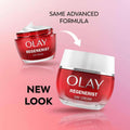 Two jars of Olay Regenerist Day Cream on a pink gradient background, with one jar showing the old red-and-white design and the other showing a new white lid, plus text reading 'SAME ADVANCED FORMULA' and 'NEW LOOK'.