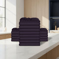 Stack of burgundy folded towels on a white background