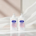 Two white pump bottles of E45 Lotion 16.9 fl oz (500ml) each, featuring a blue and pink label design on a plain white background.