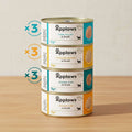 Stack of Applaws cat food tins with labels on a white background